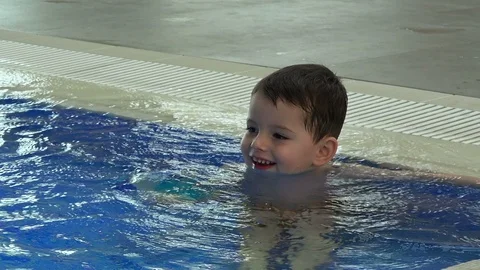 Llittle boy  in swimming  pool Stock-Footage 104544350
