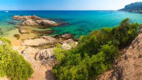 Lloret de Mar beach. Spain resort beach on sunny clear day. Sandy beach on su Foto stock