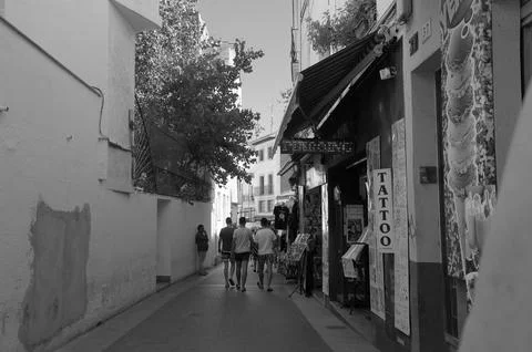 Lloret de Mar, Spain - September 7, 2024 Black and White Narrow Street with.. Фото