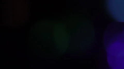 LMedium multi-colored bokeh light movement shines on black background Stock-Footage 318920058