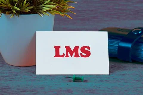 LMS stands for Learning Management System. LMS word on a business card on a c Stock Photos