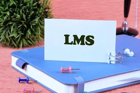 LMS stands for Learning Management System. LMS word on a business card standi Stock Photos