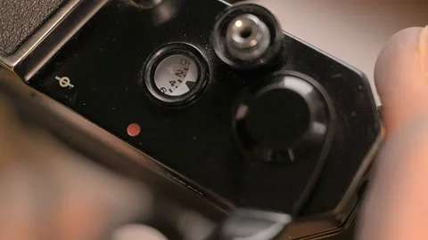 Load and shot of an old camera Stock Footage 99740274