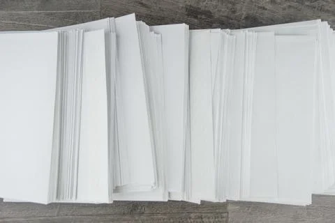 Load at work: a Huge stack of envelopes with a working mail on the accountant Stock Photos