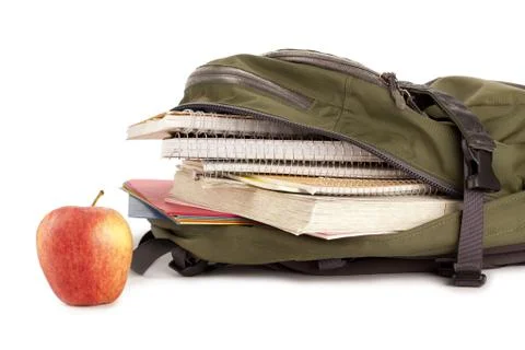 Loaded backpack and apple Stock Photos