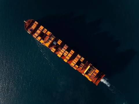 Loaded Cargo Container Ship Cruising Open Ocean Waters In Si Racha Thailand.. Stock Photos