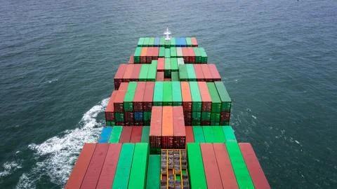 Loaded Cargo Container Ship Navigating Open Sea Waters High Angle Shot 写真素材
