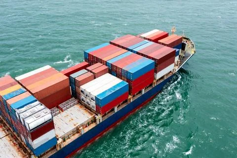 Loaded Cargo Ship Navigating Open Sea Waters Near Coastal Thailand Wide Shot Stock Photos