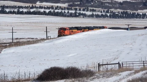 Loaded coal train enters R-L winter sunshine Stock Footage 105190899