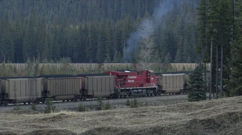 A loaded coal train moving along tracks Stock Footage 45115592
