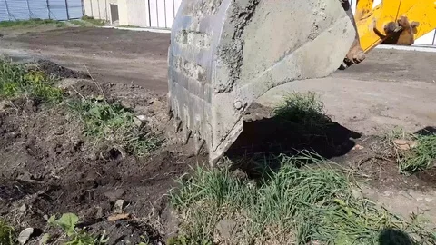 Loader backhoe, excavator digging a trench. Clip. Stock Footage 108970319