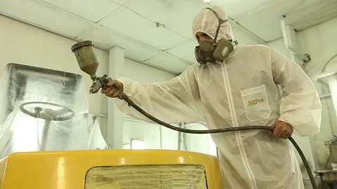 Loader being painted and varnished in a painting chamber, Spraying a cars Stock Footage 76356026