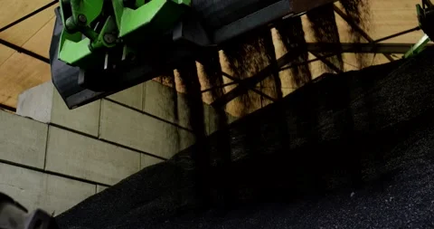 Loader Bucket Pouring Rubber Granulate, Recycling Hall Interior, Close Up Видео 340728683