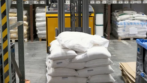 Loader carries bags. Warehouse. Pallet. Stock Footage