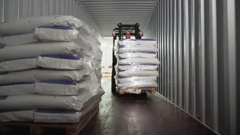 Loader driver load and unload pallets with bags Stock Footage 81248360