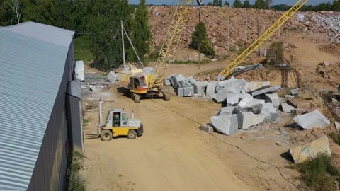 Loader drives into the warehouse where the marble is stored Video stock 141412271
