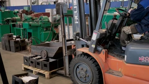 The loader at the factory lifts the load. Heavy industry plant. Stock Footage 172015116