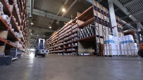 Loader at the factory with a roll Stock Footage 75327671