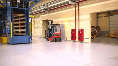 Loader loading packaged products at the factory. Stock Footage 249791540