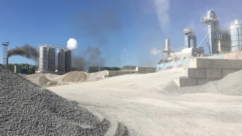 The loader loads the crushed stone into its bucket. Stock Footage 131434179