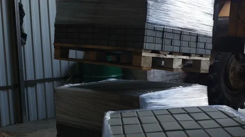 Loader loads finished interlocking concrete pavers Stock Footage 95235306