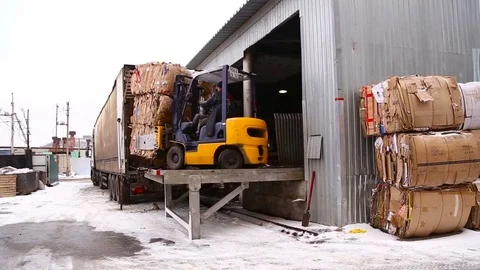 Loader loads the paper Stock Footage 69861977