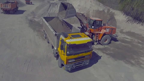 Loader loads rock on a truck Stock Footage 131381309