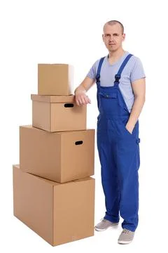 Loader man with heap of boxes isolated on white background. 库存照片