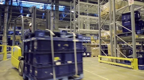 Loader operator working in warehouse Stock Footage 61122969
