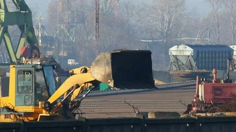 Loader at the port of ship waste Stock-Footage 58606294