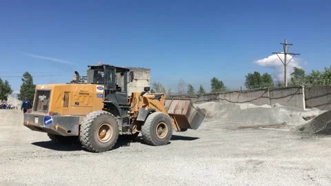 Loader pouring breakstone from its bucket. Stock Footage 131434126