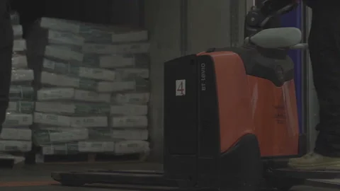 Loader unload pallets with boxes from a trailer truck.  Stock Footage 167855579