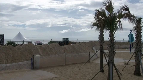 Loader unloads sand on border during preparations for Hurricane Irene - 2011 Stock Footage 106046072