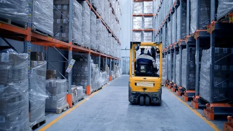 Loader works on the warehouse construction site, shipment of goods, boxes with Stock Footage 127927446