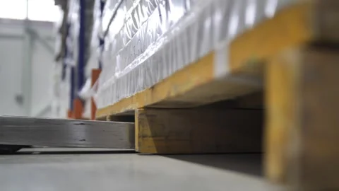 Loaders lift pallets with boxes in warehouse logistics center. 動画素材 240757282