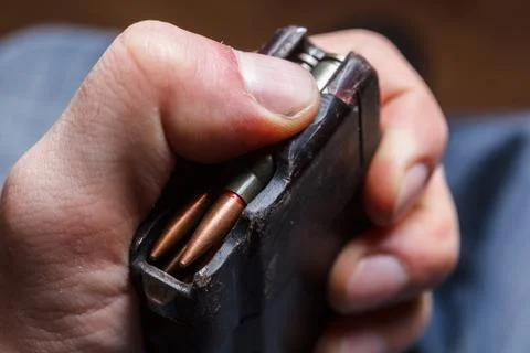 Loading 5.56 ammo magazine for machine guns Stock Photos