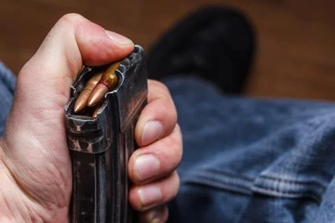 Loading 5.56 ammo magazine for machine guns Stock Photos