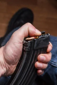 Loading 5.56 ammo magazine for machine guns Stock Photos