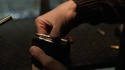 Loading 7.62 NATO Bullets Into a Magazine, for a bolt-action rifle. Stockbeeldmateriaal 321883768