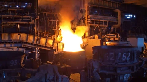 Loading additives into container with liquid metal Stock Footage 1079064