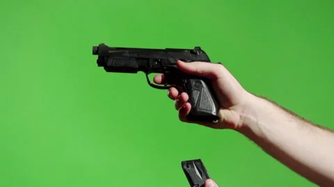 Loading and Cocking a Handgun Green Screen Stock Footage 43063946