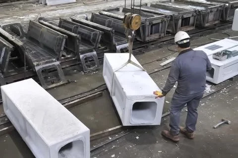 Loading and moving finished concrete product from the mold after hardening Stock Photos