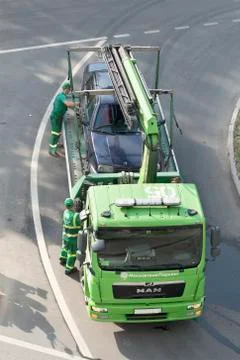 Loading and towing a car for improper parking Stock Photos