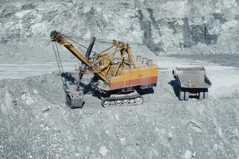 Loading and transportation of stone chips on dump trucks in quar Stock Photos