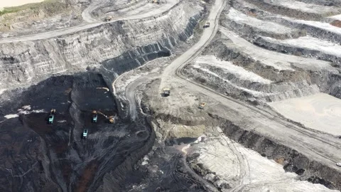 Loading and unloading activities of coal trucks in the coal mining pit area Stock Footage 328971567