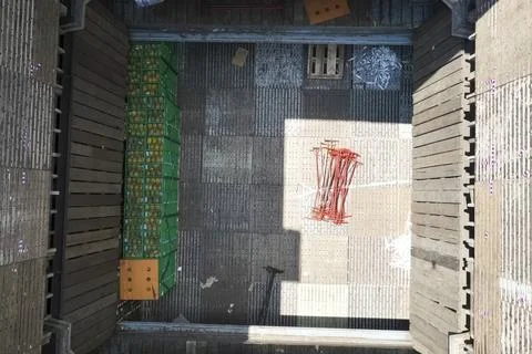 Loading and unloading of boxes with pineapples from hold of a dry cargo ship. 写真素材