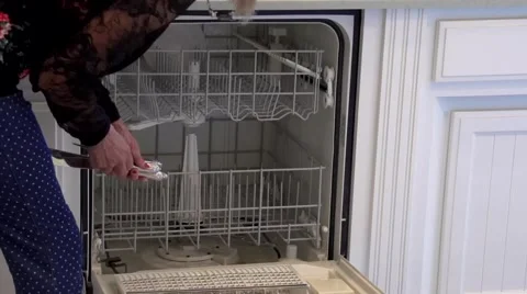 Loading and Unloading a Dishwasher in Timelapse Stock Footage 58997337