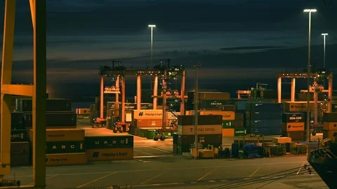Loading and unloading of goods, containers on ships at industrial port Stock Footage 104754590
