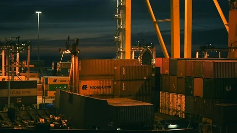 Loading and unloading of goods,  containers on ships at industrial port Stock Footage 104802568
