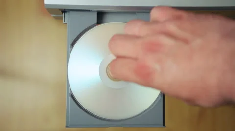Loading and unloading laser disc from the DVD/CD player Stock Footage 49687946